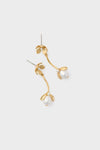 Gold Maryanne Earrings with a classic floral motif, featuring an effortless gold-tone design and a fun white teardrop pearl, exuding a high-end charm.