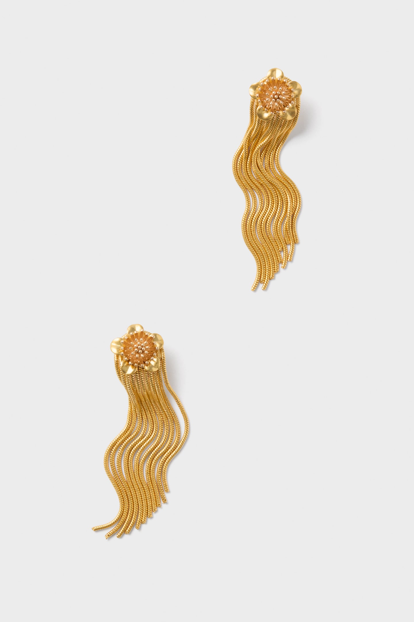 Gold Smooth Moves Earrings feature classic floral studs with effortless, fun cascading chains, offering a high-end, dynamic elegance suitable for any occasion.