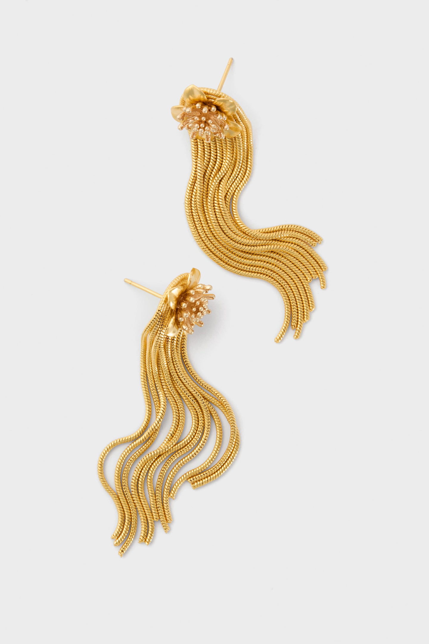 Gold Smooth Moves Earrings feature classic floral studs and effortless cascading tassels. Handmade with high-end 24K antique gold-plating, they offer a fun, featherweight design.