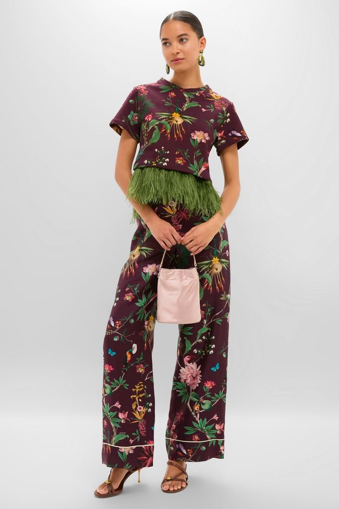 Model in a classic, effortless burgundy outfit showcasing Malachite River Rock 2 Drop Earrings, adding a fun, high-end touch with resin stones and brass detailing.