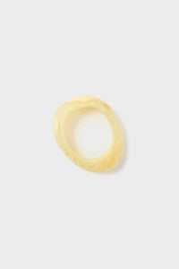 Lemon Rock Small Bangle in marbled yellow resin, featuring an organic silhouette. A classic, effortless accessory that embodies fun and high-end style, perfect for versatile wear.