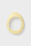 Lemon Rock Small Bangle: A classic, chunky oval bracelet in marbled resin. Effortless and fun, it embodies high-end style with its organic, minimalist design.