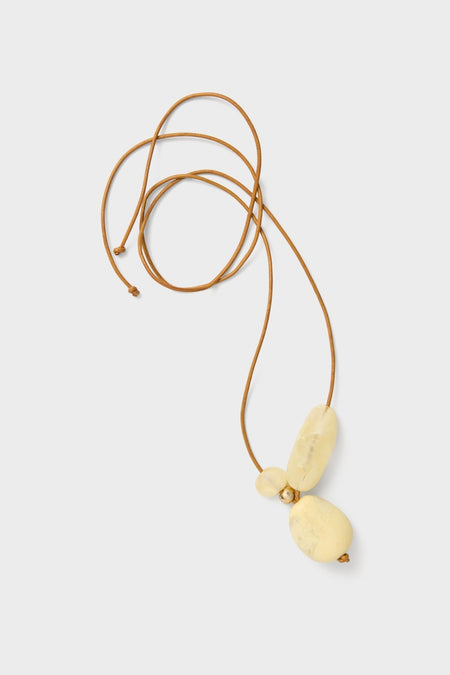 Classic Lemon Brass Rock Cluster Pendant featuring three resin beads on an adjustable leather cord. Effortless, fun design perfect for high-end, everyday style.