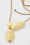 Lemon Brass Rock Cluster Pendant on leather cord, featuring three classic resin beads and gold spacer, offering an effortless, high-end touch to any outfit.