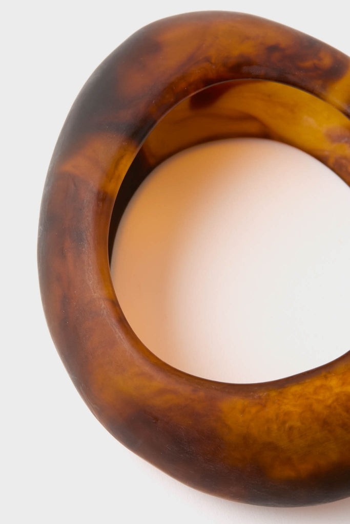 Tortoise Rock Medium Bangle: A classic, chunky bracelet in tortoiseshell-style resin, exuding effortless elegance and high-end flair, perfect for fun, confident accessorizing.