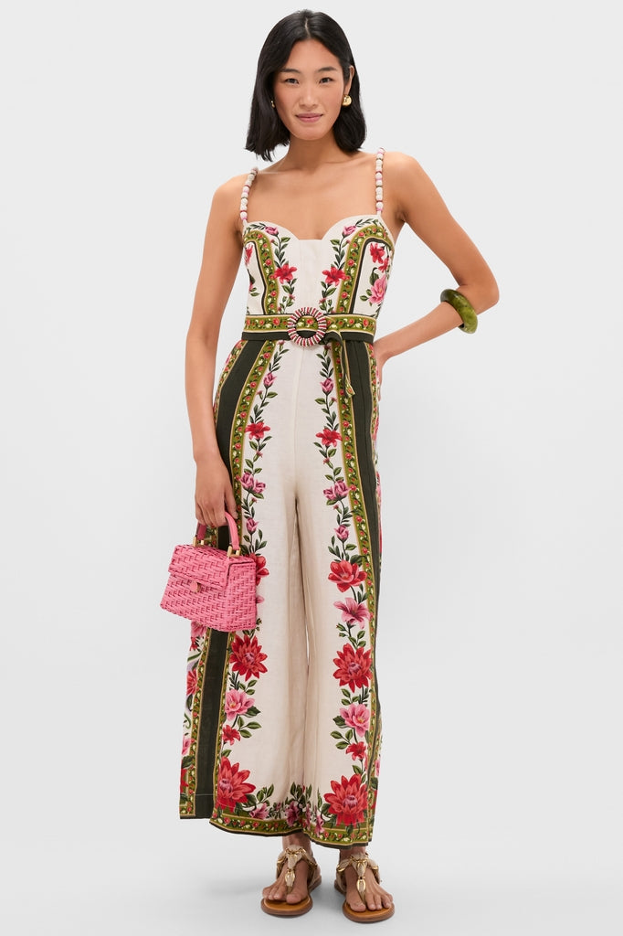 Model wearing a classic, cream jumpsuit with floral embroidery and a Malachite Rock Large Bangle, exuding effortless style with fun, high-end accessories.