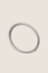 Classic and effortless, the Silver Gia Bangle features a smooth, polished surface with a hinge push closure, embodying a fun, high-end style ideal for any occasion.