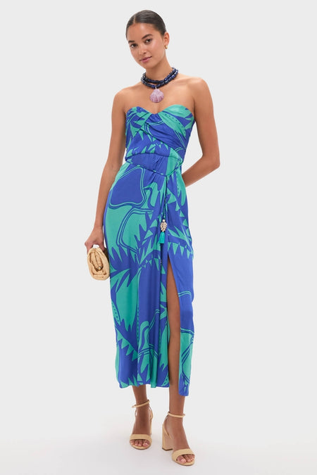 Model wearing a strapless dress with a bold print, accessorized with a classic Navy and Lilac Luma Necklace, embodying an effortless, fun, and high-end style.