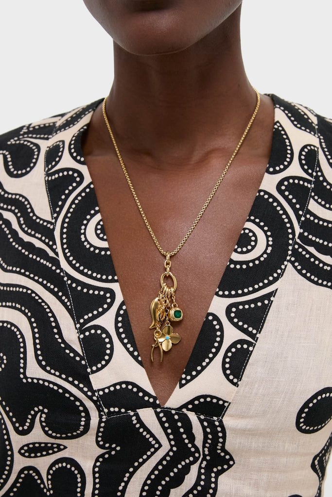 Gold Buona Fortuna Necklace with classic gold charms, including a clover and wishbone, on a fine chain. Effortless, high-end design perfect for fun layering.