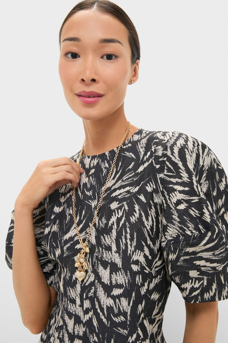 Woman wearing Gold The Family of Hearts Pendant with heart and leaf charms on a gold-tone chain. Classic, effortless style perfect for any occasion.