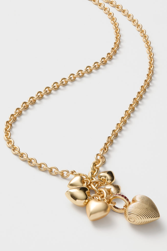 Gold The Family of Hearts Pendant features classic, effortless heart charms on a high-end adjustable chain, perfect for adding fun elegance to any outfit.