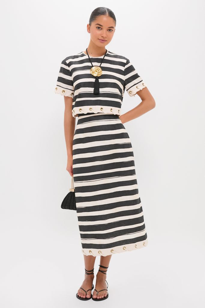 Model wearing a classic, high-end striped set, showcasing the Gold and Black Hebe Necklace for an effortless, fun, and confident look.