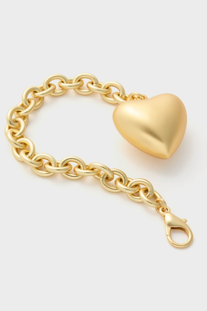 Gold Puffy Heart Bracelet features a classic chunky chain with a smooth heart charm, lobster clasp closure; an effortless, fun, high-end accessory for versatile styling.