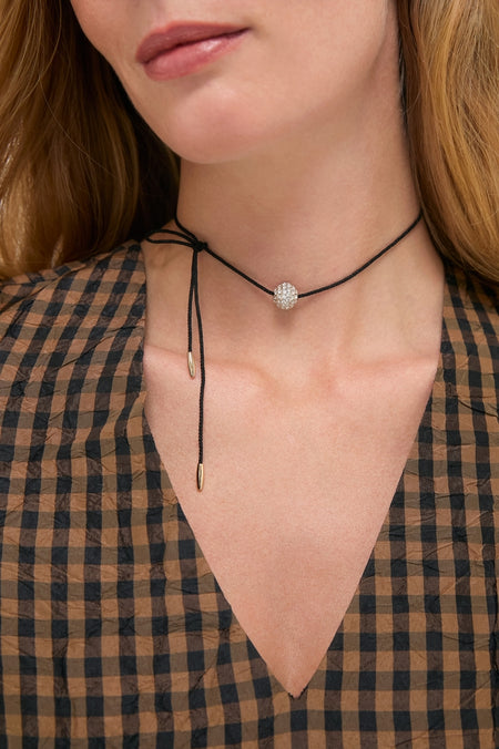 Gold and Black Spark Necklace, a classic yet modern choker with pavé bead, adds effortless elegance to any outfit, making it a fun, high-end accessory.