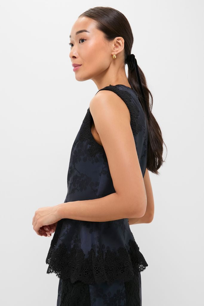 Navy and Black Lace Margy Top with peplum hem and scalloped lace, offering a classic yet effortless style, perfect for transitioning from office to a fun night out.