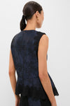 Classic Navy and Black Lace Margy Top with scalloped lace trim and peplum, embodying effortless elegance and fun style, perfect for high-end day-to-night transitions.