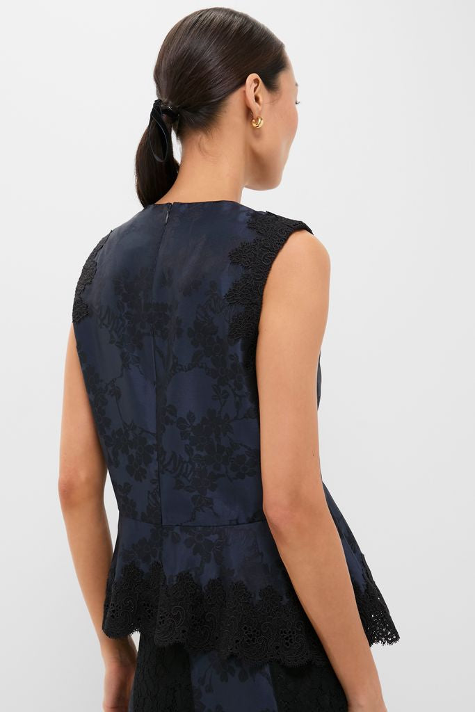 Classic Navy and Black Lace Margy Top with scalloped lace trim and peplum, embodying effortless elegance and fun style, perfect for high-end day-to-night transitions.