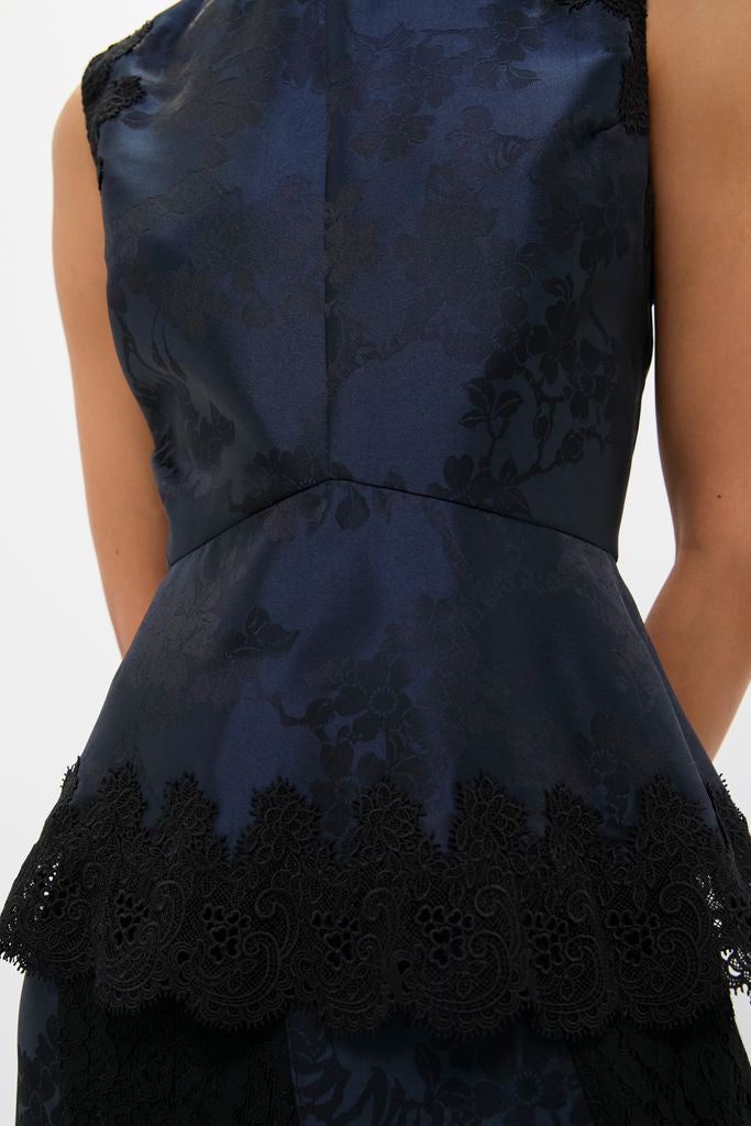 Navy and Black Lace Margy Top with classic peplum, effortless floral jacquard, and fun lace trim. High-end style for versatile day-to-night wear.