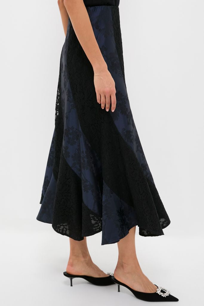Navy Jacquard and Black Lace Mallory Skirt showcases a classic, effortless A-line design with fun floral jacquard and lace, embodying high-end elegance for any occasion.