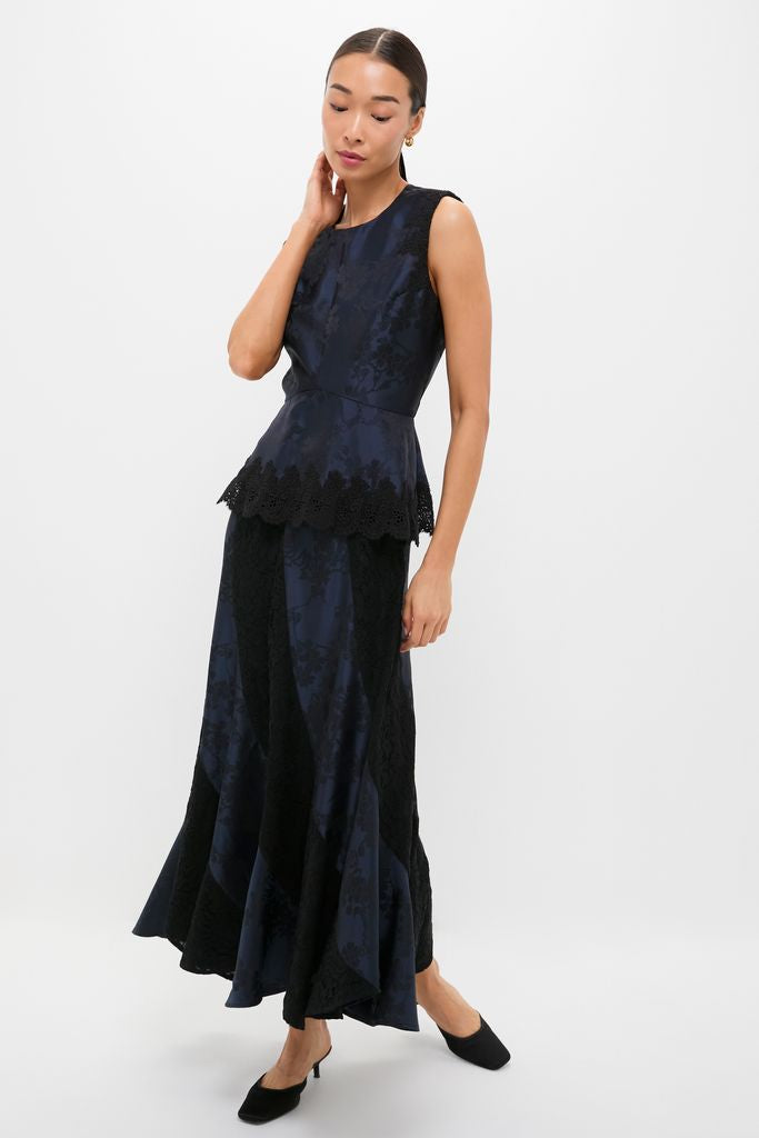 Effortlessly chic, the Navy Jacquard and Black Lace Mallory Skirt offers a classic, fun A-line silhouette, paired with a matching peplum top for a high-end look.