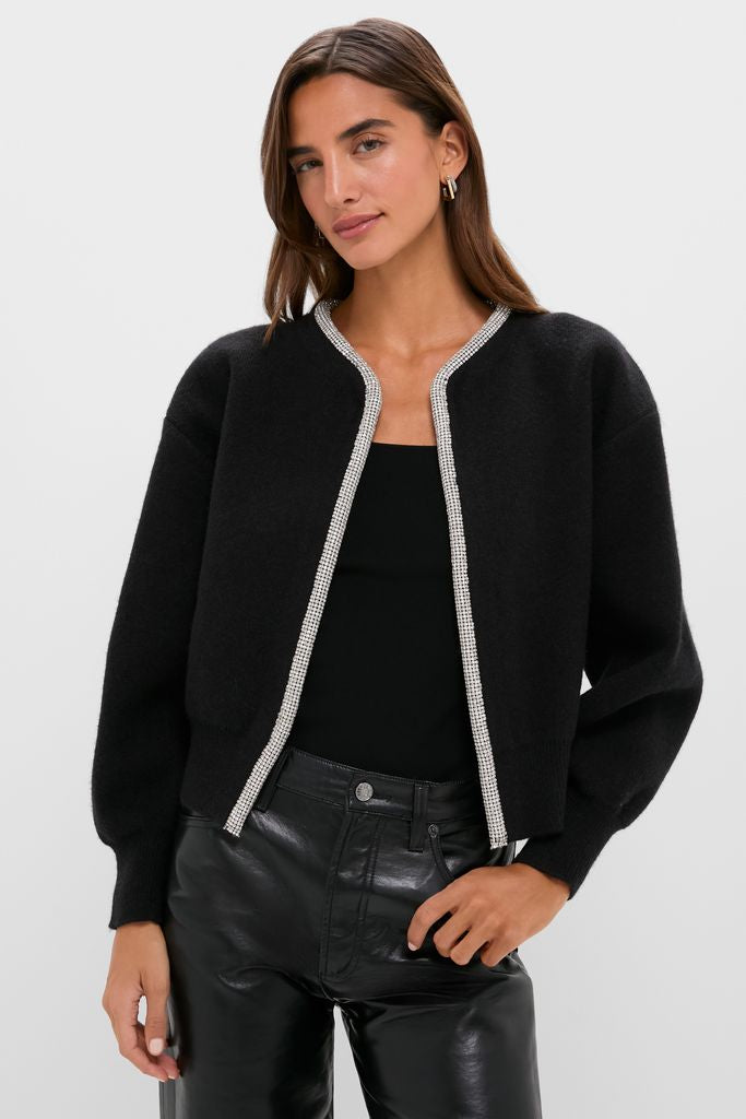 Black Sequin Trim Naomi Cardigan worn effortlessly with high-waisted leather pants, exuding a classic and fun high-end style.