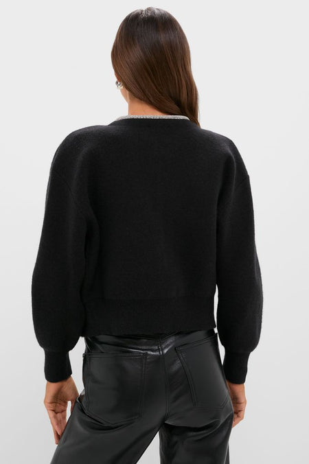 Black Sequin Trim Naomi Cardigan, a classic and effortless sweater with sparkly neckline trim, paired with high-waisted leather pants for a fun, high-end look.