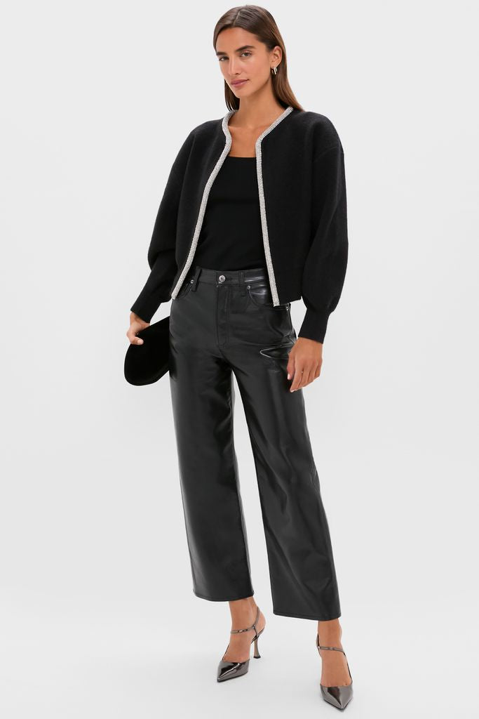 Black Sequin Trim Naomi Cardigan worn over a black tank, paired with high-waisted faux-leather pants and heels, creating a classic, effortless, high-end look.