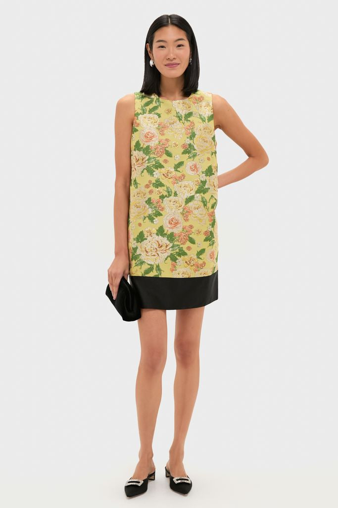 Chrysanthemum Jacquard Arcati Dress: a classic, effortless shift dress with floral jacquard, contrast hemline, paired with a black clutch and flats for a fun, high-end look.