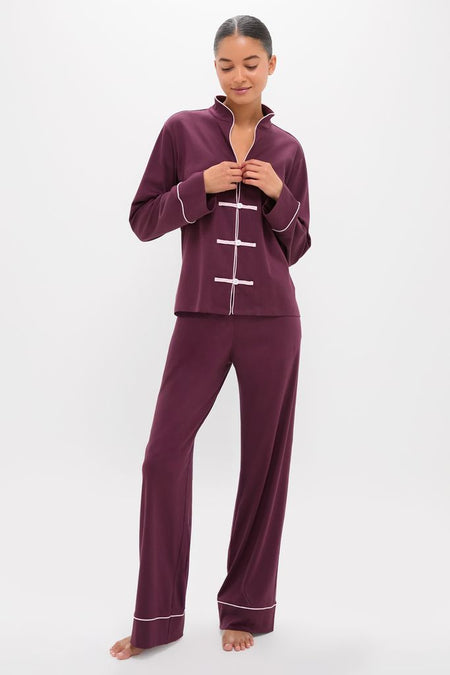 Model wearing the classic Winetasting Wilford Women's Pajama Set with Mandarin collar and frog buttons, exuding effortless elegance and high-end comfort in deep plum with white piping.