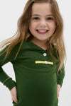 Young girl wearing the classic Douglas Fir Pima Cotton Arien Kid's Pajama Set, featuring a mandarin collar and contrast trim, embodies effortless, high-end comfort and fun.