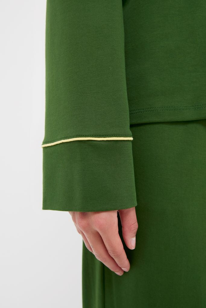 Close-up of a classic Green Wilford Women's Pajama Set with flared cuff and yellow piping. Effortless, fun, high-end style from Tuckernuck.