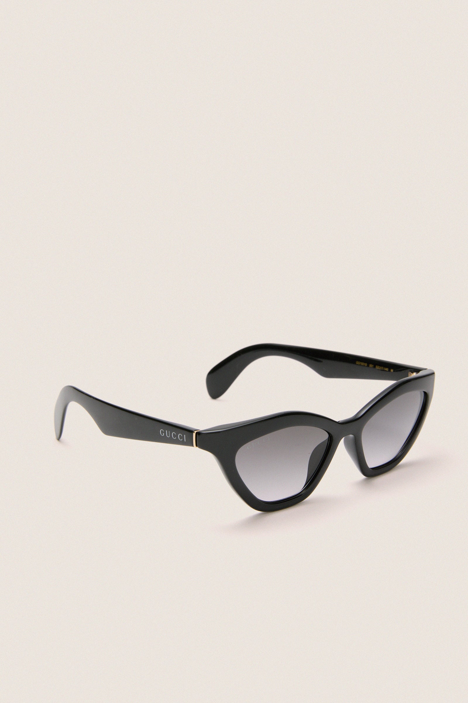 Shiny Black Cat-Eye Mods Sunglasses, a classic Gucci design, featuring a sophisticated cat-eye shape and gradient lenses for an effortless, fun, and high-end look.