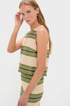 Model in Satin Stripe Kerri Top, a classic, effortless sleeveless shift with broad olive stripes, styled for a fun, high-end look with matching skirt.