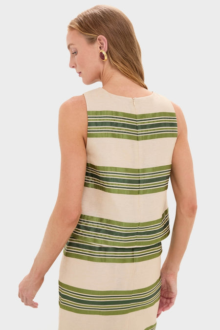 Woman wearing classic Satin Stripe Kerri Top with olive-green stripes, flaunting an effortless, high-end style. Perfectly paired with the matching skirt for a fun, coordinated look.