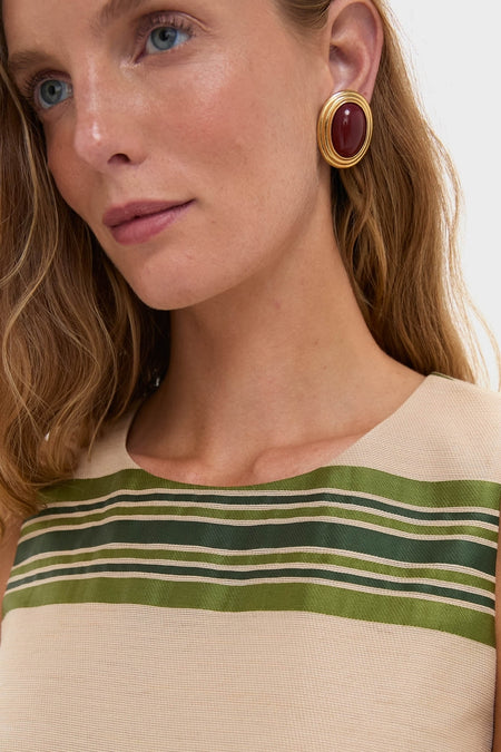 Model wears the Satin Stripe Kerri Top, showcasing its classic, effortless style with a luxe satin stripe and boxy fit, epitomizing fun and high-end fashion.