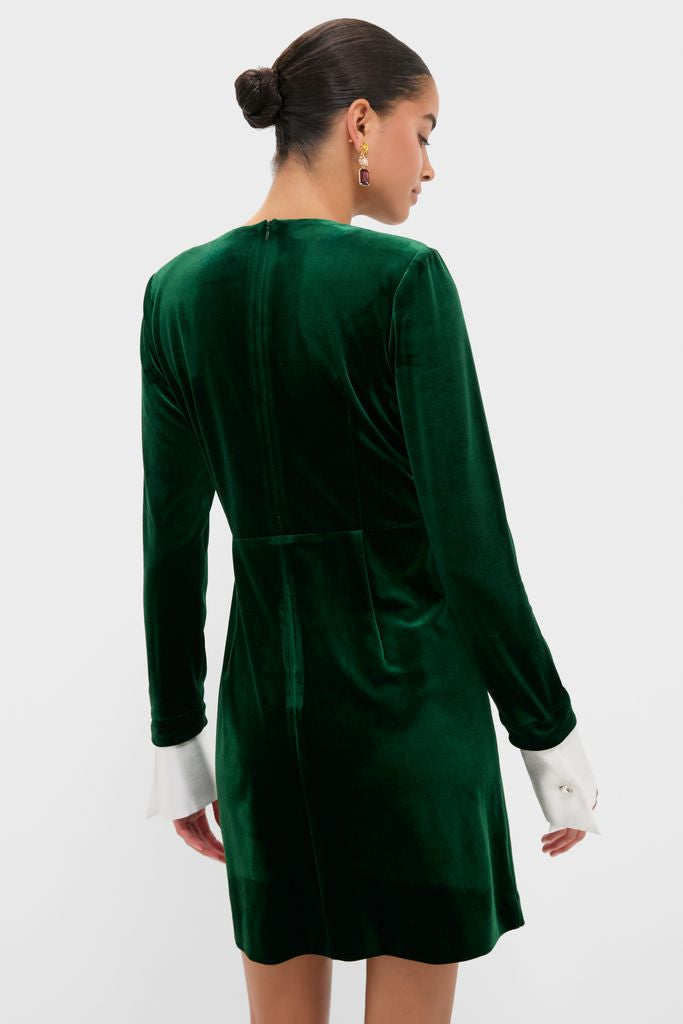 Hunter Green Velvet Etta Mini Dress with removable white cuffs, classic round neckline, and gold drop earrings, offering an effortless, high-end look for festive fun.