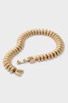 High Polish Gold Sofia Bracelet features classic, ribbed donut links in a fluid caterpillar design, offering an effortless and high-end touch to any ensemble.