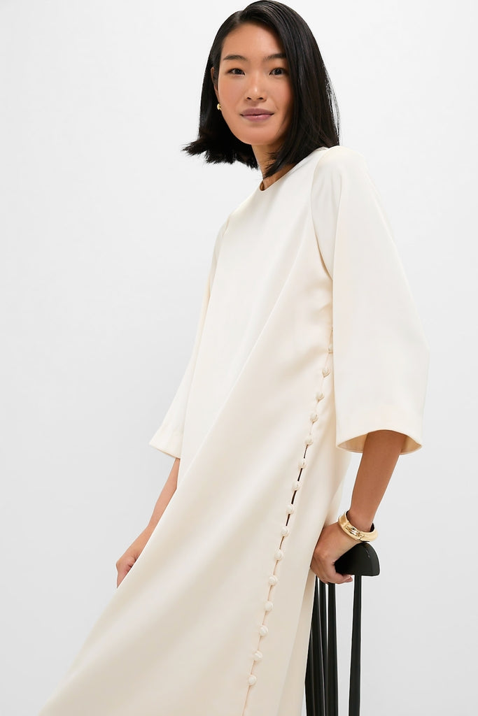 Winter White Side Button Jamie Dress: A classic, loose-fitting midi with functional side buttons, offering an effortless, high-end style perfect for fun occasions.