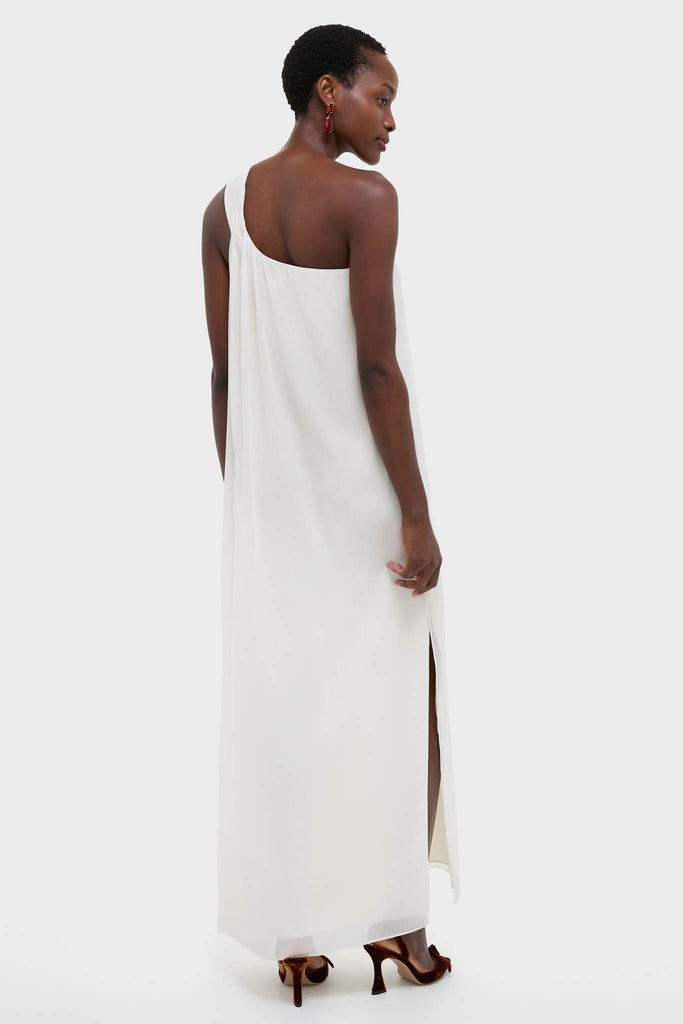 Dark-skinned woman in an Ivory Soleil Gown, showcasing its classic one-shoulder design and high side slit, exuding an effortless, high-end elegance.
