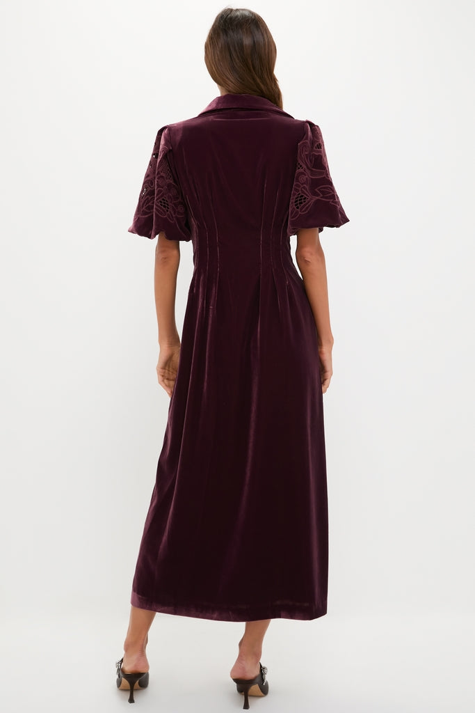 Woman in Winetasting Velvet Lace Delaney Dress with classic tailored bodice, bell sleeves, and A-line skirt, embodying effortless, high-end style for fun celebrations.