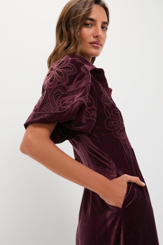 Classic side view of a model in the Winetasting Velvet Lace Delaney Dress, showcasing its effortless style with puff sleeves, embroidery, and a chic, fun fit.