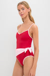 Poppy and Pink Cleo One Piece with Scarf: A classic, high-end red swimsuit featuring an effortless light-pink sash, embodying fun and confidence, perfect for a chic, carefree style.