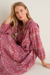 Model wearing the classic Americana Batik Stripe Long Sleeve Salty Paloma Caftan, showcasing its effortless, high-end design with floral print and blouson sleeves, exuding fun elegance.