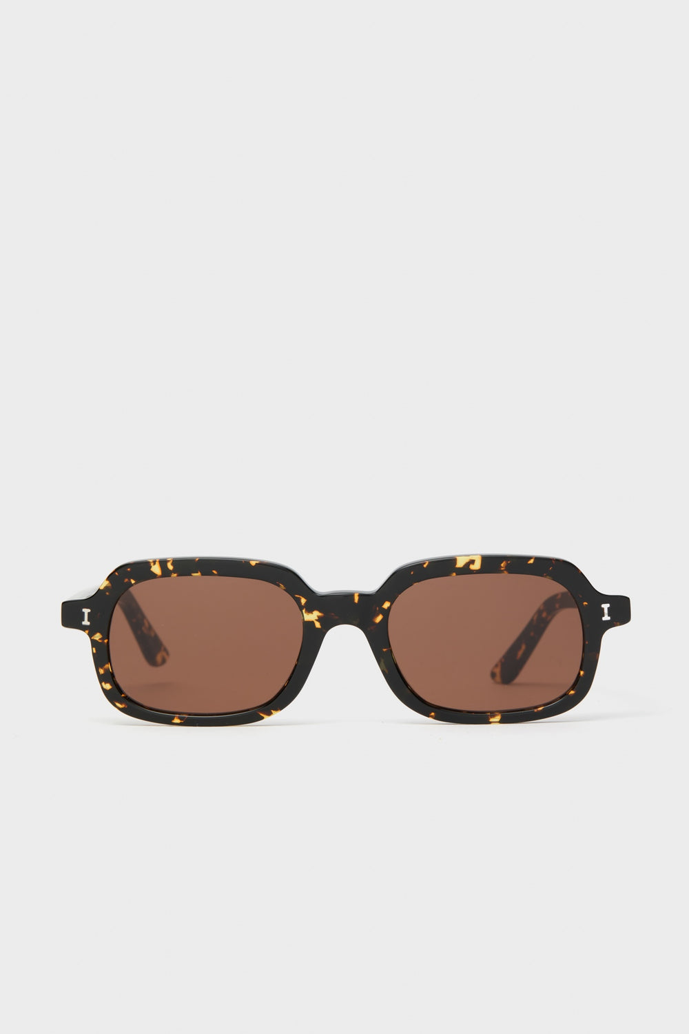 Flame Berlin Sunglasses feature a classic rectangular tortoiseshell frame with brown lenses, offering effortless, high-end style for daily wear or fun getaways.