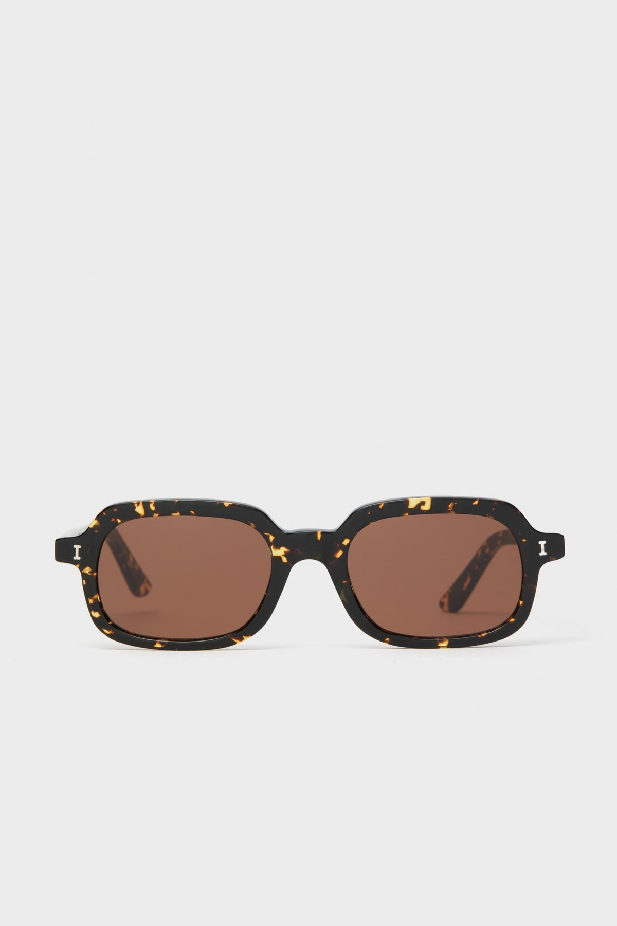 Flame Berlin Sunglasses feature a classic rectangular tortoiseshell frame with brown lenses, offering effortless, high-end style for daily wear or fun getaways.