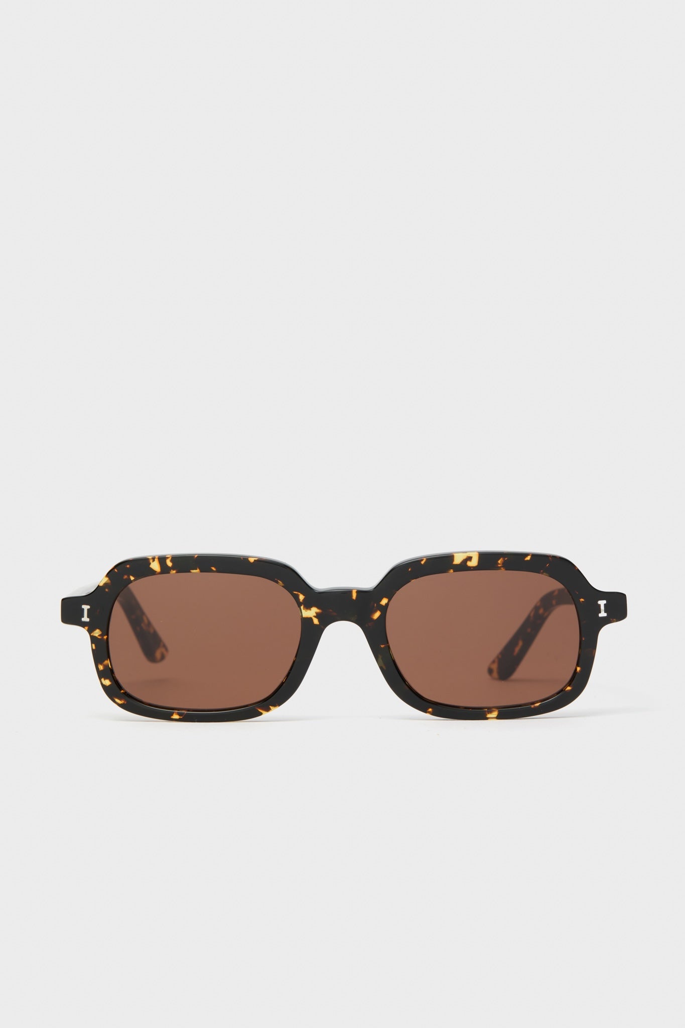 Flame Berlin Sunglasses feature a classic rectangular tortoiseshell frame with brown lenses, offering effortless, high-end style for daily wear or fun getaways.