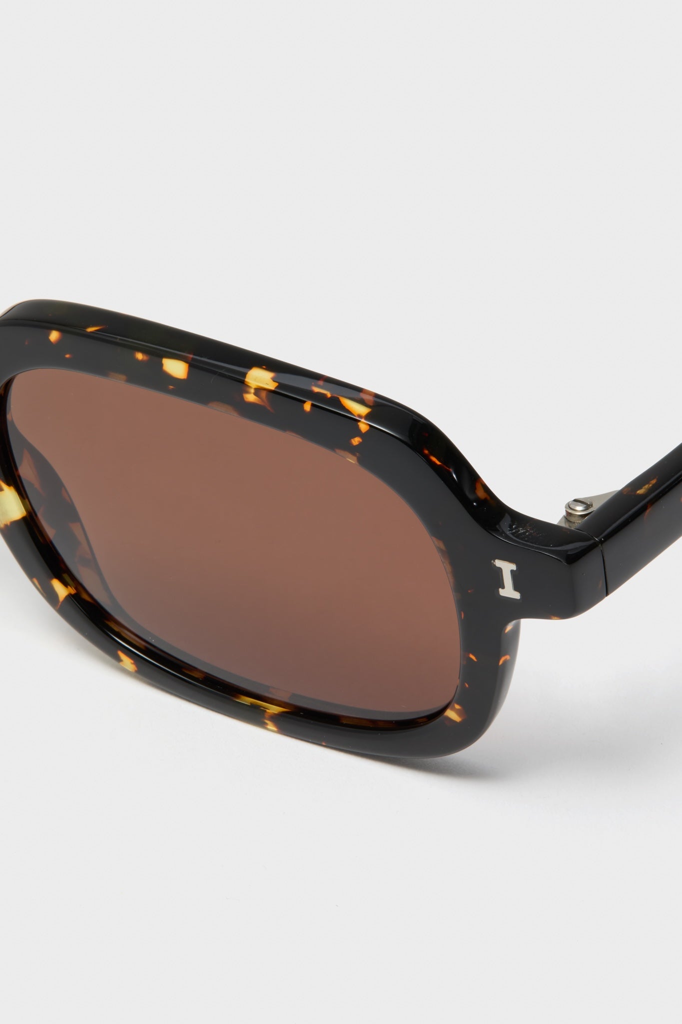 Flame Berlin Sunglasses with a classic, chunky tortoiseshell frame and brown lenses. Effortlessly chic and high-end, perfect for fun, everyday wear.