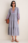Woman wearing the Navy Prism Embroidered Gingham Long Sleeve Salty Paloma Caftan, showcasing a classic, effortless style with fun, high-end details.