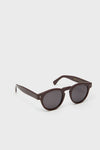 Bordeaux Leonard Sunglasses showcase classic, high-end design with round, dark-tinted lenses and effortless brown acetate frames, embodying Tuckernuck's fun and stylish shopping experience.