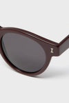 Bordeaux Leonard Sunglasses feature classic, glossy dark brown acetate frames with round lenses and a metallic I logo, offering an effortless, high-end style.